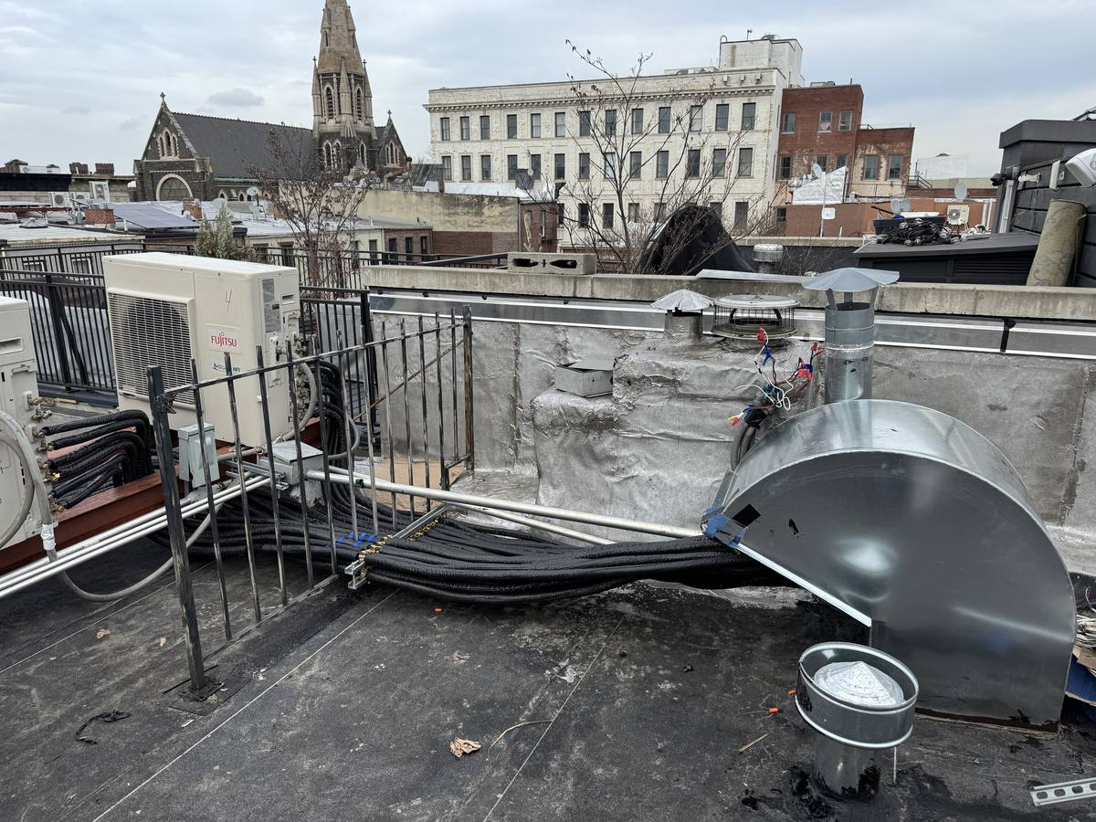 Brooklyn rooftop heat pump equipment near historic buildings